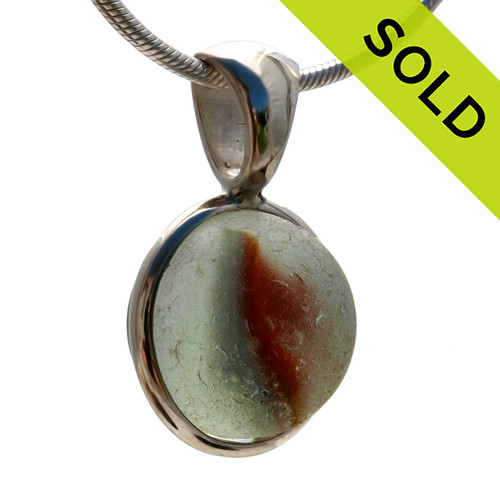 A stunning orange cats eye sea glass marble mixed in our Deluxe Wire Bezel© pendant setting.
SOLD - Sorry this Ultra Rare Sea Glass Pendant is NO LONGER AVAILABLE!