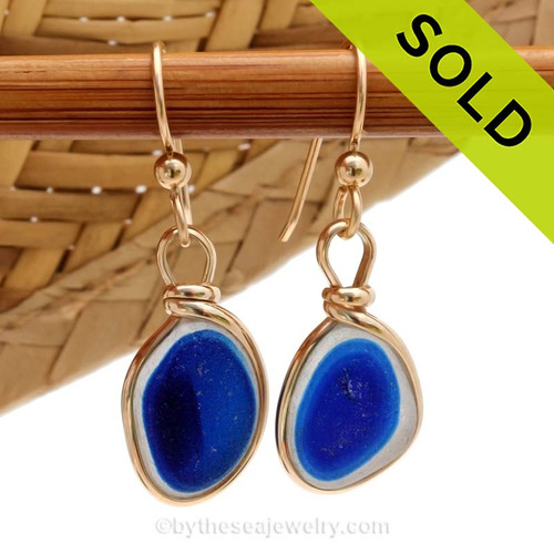 An ultra rare match of mixed flashed blue English sea glass pieces from Seaham England in our Original Gold Wire Bezel© sea glass earring setting. Sorry these Ultra Rare Sea Glass Earrings h ave been SOLD!