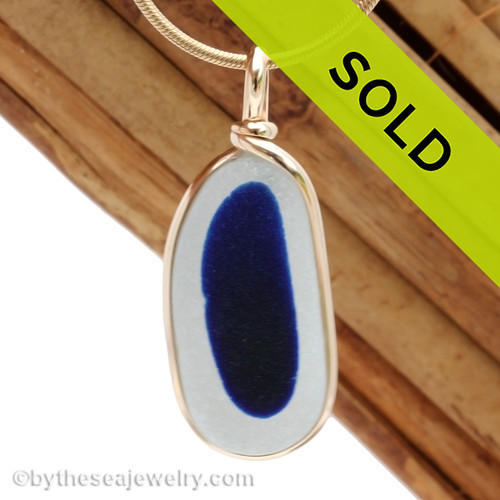This LARGE & Long is a stunning piece of Flashed Blue & Pure White  EndODay sea glass set in our Original Wire Bezel© pendant setting in gold. Classic and timeless.
Sorry this sea glass necklace pendant has been sold!