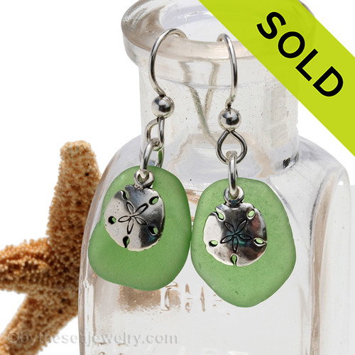 A simple pair of genuine green sea glass earrings with sterling silver sandollar charms in a lightweight simple setting.
Sorry this Sea Glass Jewelry selection has been SOLD!