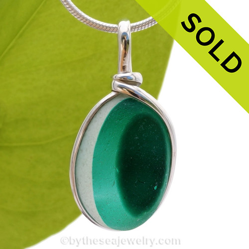 An unusual piece of mixed Teal Green English Multi sea glass set for a necklace in our Original Sea Glass Bezel© in solid sterling silver setting.