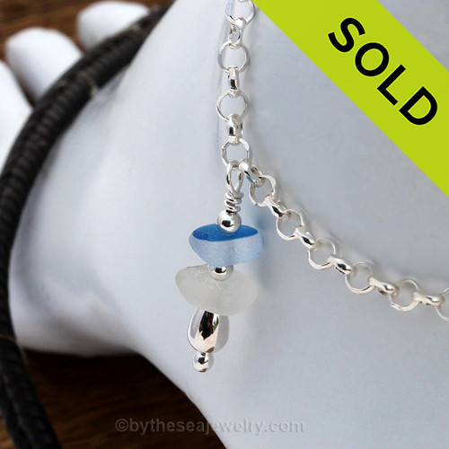 Simple sea glass ankle bracelet in silver with mixed English Flashed Blue and a piece of pure white.
Sorry this Sea Glass Jewelry selection has been SOLD!