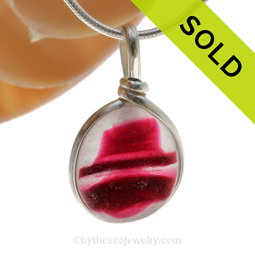 A vivid mix of hot pink in a base of pure white endoday sea glass from England set in our Original Wire Bezel© necklace pendant setting.