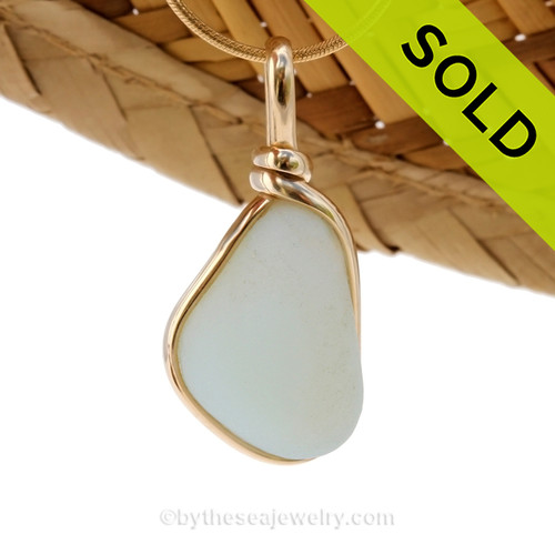 A stunning piece opalized sea glass set in our Original Wire Bezel© pendant setting in gold. 
SOLD - Sorry this Ultra Rare Sea Glass Pendant is NO LONGER AVAILABLE!