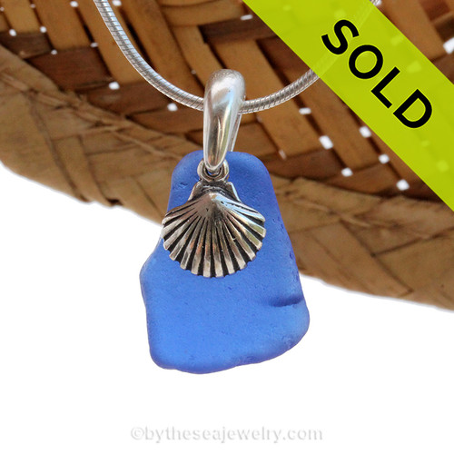 A smaller piece of Cobalt Blue Certified Genuine Sea Glass in a Sterling Necklace with a Shell Charm.
Sorry this Sea Glass Necklace HAS BEEN SOLD!
