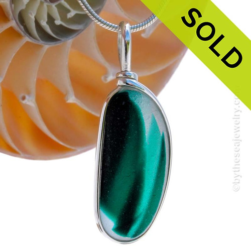 An unusual piece of mixed Long Teal Green English Multi sea glass set for a necklace in our Original Sea Glass Bezel© in solid sterling silver setting.
Sorry this Sea Glass jewelry selection has been sold!