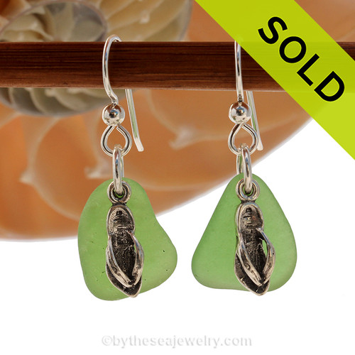 Natural bright green sea glass pieces are set with solid sterling flip flop charms and are presented on sterling silver fishook earrings.
SOLD - Sorry these Sea Glass Earrings are NO LONGER AVAILABLE!
