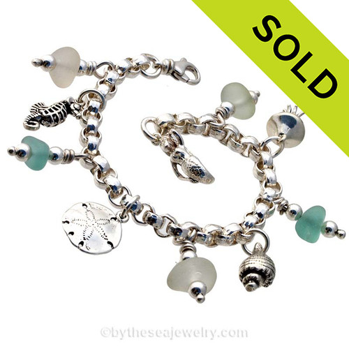 Stunning  sea glass from England is the result of art glass scraps being discarded into the North Sea.
Solid Sterling charms and a heavy rolo bracelet with soldered utility links ensure this piece will remain with you always!
SOLD - Sorry this Sea Glass Charm Bracelet is NO LONGER AVAILABLE!