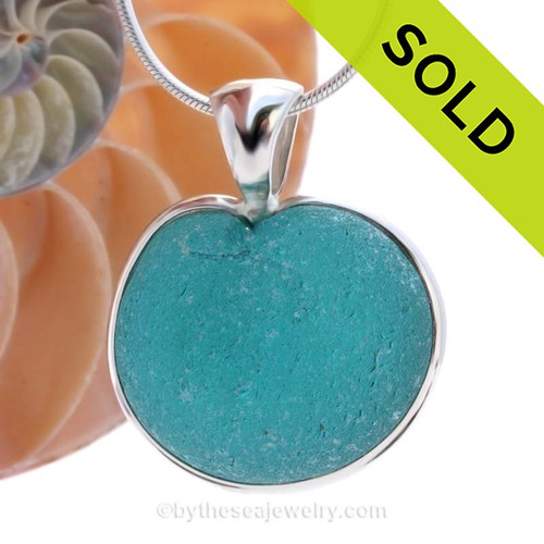 ONCE-IN-A-LIFETIME HUGE Natural Sea Glass Heart set in our deluxe wire bezel pendant setting!
This piece features the glass and beauty of the teal/aqua sea glass and is presented on a professionally our Deluxe Wire Bezel Setting© that leaves the sea glass UNALTERED from the way it was found on the beach. 
SOLD - Sorry this Ultra Rare Sea Glass Pendant is NO LONGER AVAILABLE!
