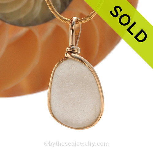 A nice pure white natural sea glass piece set in our Original Wire Bezel setting in 14K Rolled Gold setting.
Shown here on our 1.6 MM snake chain which is available as an upgrade.
SOLD - Sorry this Sea Glass Pendant is NO LONGER AVAILABLE!