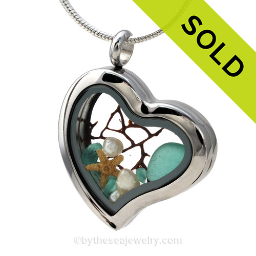Vivid Aqua sea glass combined a large silver heart locket necklace with Fresh Water Pearls and a bit of vintage seafan