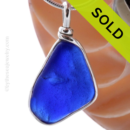 A LARGE and UNIQUE piece of Campfire Cobalt Blue Genuine Sea Glass with in our signature Original Wire Bezel© pendant setting in Sterling Silver.
SOLD - Sorry this Rare Sea Glass Pendant is NO LONGER AVAILABLE!