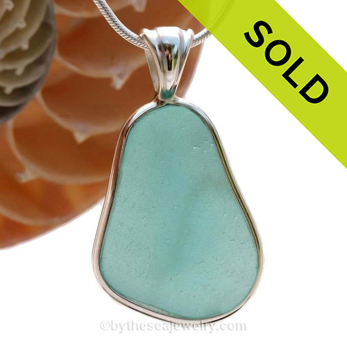 A wonderful PERFECT and HUGE piece of Vivid Aqua Genuine Sea Glass in our In Our Deluxe Sterling Wire Bezel© Necklace Pendant.
SOLD - Sorry this Rare Sea Glass Pendant is NO LONGER AVAILABLE!