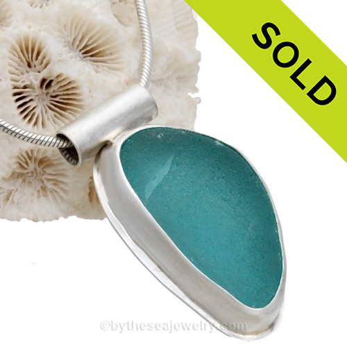 Electric Aqua or Turquoise in Classic Bezel of Sterling & Fine Silver with Sterling Tube Bail.
SOLD - Sorry this Sea Glass Jewelry Selection is NO LONGER AVAILABLE!