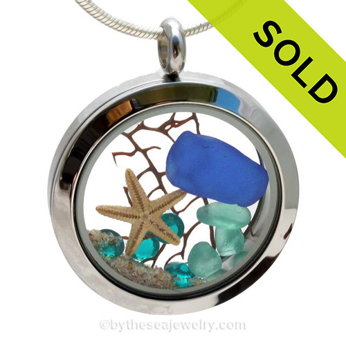 A BEAUTIFUL Natural Cobalt Blue beach found Sea Glass Locket Necklace with a real starfish and Vivid Aqua or Zircon Crystal Gems.
SOLD - Sorry this Sea Glass Locket is NO LONGER AVAILABLE!
