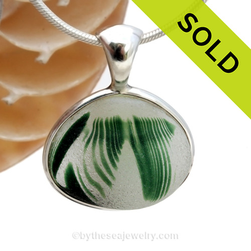 STUNNING beach found Sea Glass from Lundberg Art glass Scraps set in our Deluxe Sterling Wire Bezel© setting in Sterling Silver.
SOLD - Sorry this Ultra Rare Sea Glass Pendant is NO LONGER AVAILABLE
