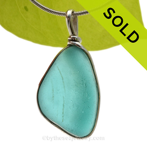 This is our Original Wire Bezel© design that leaves the glass UNALTERED from the way it was found on the beach. Beautiful, Classic and Versatile.
SOLD - Sorry this Rare Sea Glass Pendant is NO LONGER AVAILABLE!