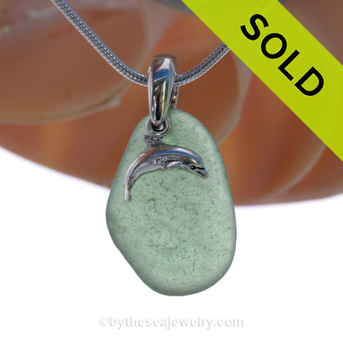 Genuine Unusual green Sea Glass Necklace with Beach found Sea Glass Necklace with a Solid Sterling Dolphin Charm and Solid Sterling Silver Snake chain.
SOLD - Sorry this Sea Glass Necklace is NO LONGER AVAILABLE!
