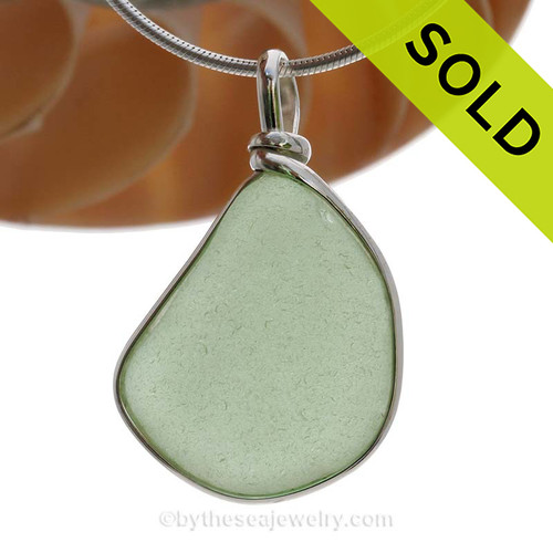 This is a beautiful and Large Yellowy Seafoam Green Genuine Sea Glass Pendant in our Original Wire Bezel© setting in Solid Sterling Silver .
SOLD - Sorry this Sea Glass Pendant is NO LONGER AVAILABLE!