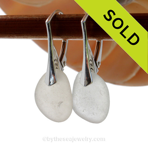 A pair of surf tumbled beach found Genuine Sea Glass Earrings in White on solid sterling leverbacks.