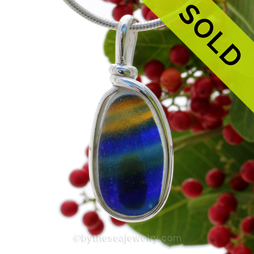 A vivid mix of electric golden yellow, green and blue in this in a base of pure white endoday sea glass from England set in our Original Wire Bezel© necklace pendant setting.
SOLD - Sorry this Rare Sea Glass Pendant is NO LONGER AVAILABLE!