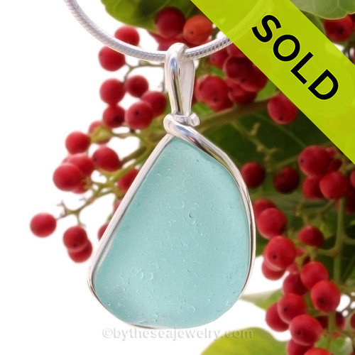 This is a beautiful Bright Vivid Aqua Sea Glass set in our Original Wire Bezel© pendant setting in Sterling Silver.
SOLD - Sorry this Rare Sea Glass Pendant is NO LONGER AVAILABLE!