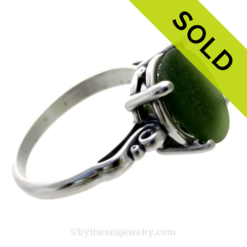 A stunning beautiful piece of vivid Seaweed green sea glass from set in a silver ring.