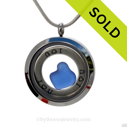 Genuine rare Cobalt Blue heart shaped sea glass combined and a Solid Sterling i ♥ U circle charm, in this stainless steel locket.
SOLD - Sorry this Sea Glass Jewelry selection is NO LONGER AVAILABLE!