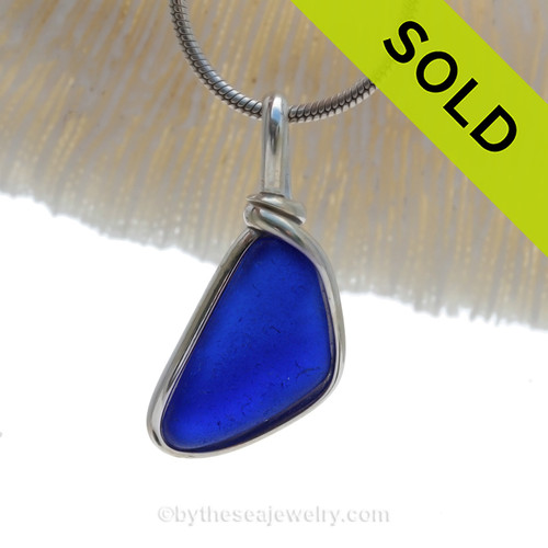 A VIVID Cobalt Blue sea glass set in our Original Deluxe Wire Bezel© necklace pendant.
