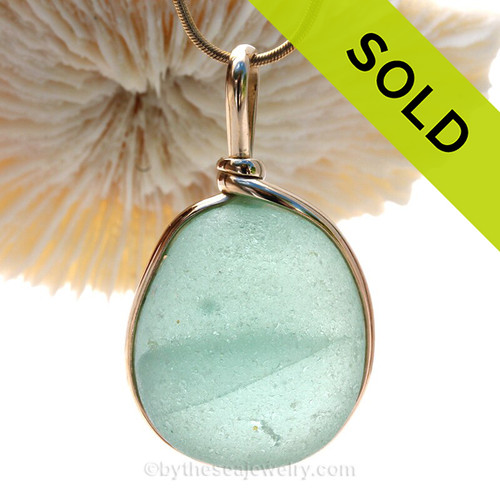 A LARGE and THICK beach found Sea Green Genuine Sea Glass Pendant in our Original Wire Bezel in 14K Rolled Gold
This is our Original Wire design that leaves the glass UNALTERED from the way it was found on the beach. 
The 14K goldfilled bezel makes this a classic and timeless piece of jewelry.