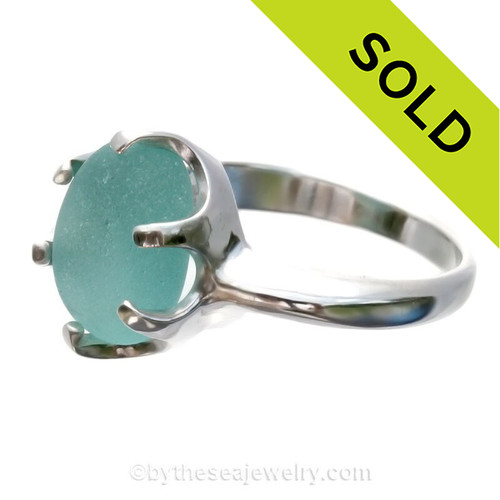 A stunning piece of Victorian Era Aqua sea glass set in a secure solid sterling prong ring.