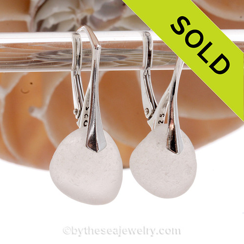 A pair of surf tumbled beach found Genuine Sea Glass Earrings in Pure White on solid sterling leverbacks.