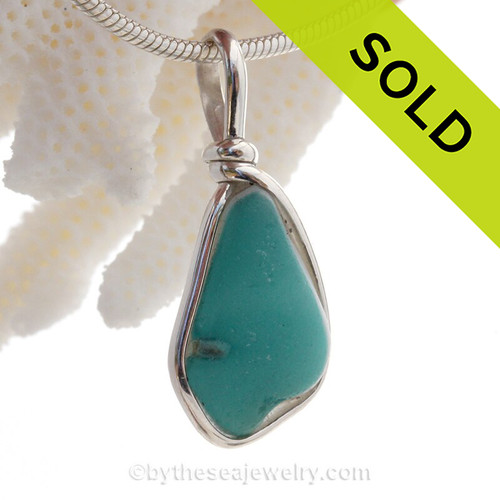 A Lovely Petite Flashed Electric Opaque Aqua & Milk Glass set in Sold Sterling Silver Deluxe Wire Bezel© pendant setting.