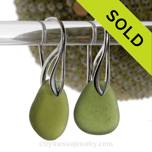 Lovely and Glowing Seaweed Green Sea Glass Earrings on Sterling Silver Deco Hooks.
Simple and elegant with genuine sea glass pieces