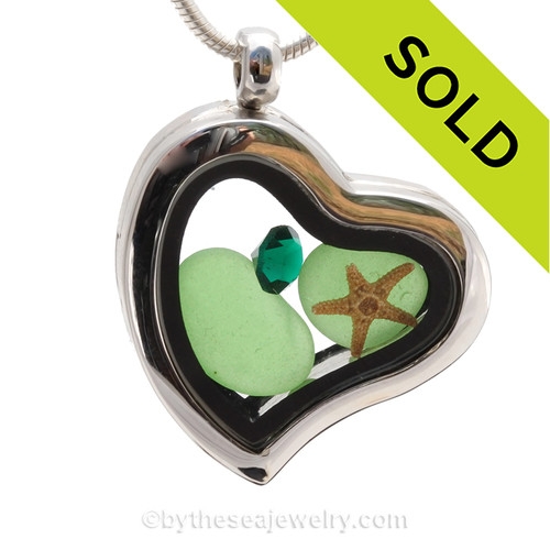 Simple and lovely green beach found Sea Glass combined a silver Heart Locket necklace with a real starfish and an Emerald Green like Crystal Gem.