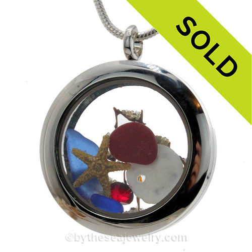 Red and blue sea glass are combined with a real baby starfish in this stainless steel locket necklace.