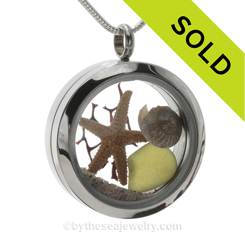 Genuine peridot green Sea Glass Locket with a small REAL starfish and tiny nautilus shell a real beach sand in this stainless steel locket.