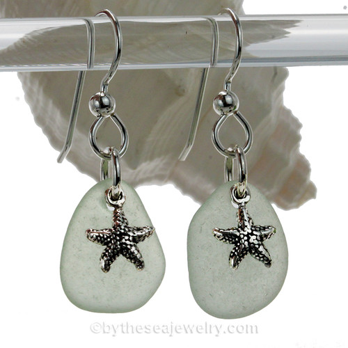 Natural pale seafoam green sea glass earrings are set with solid sterling  starfish charms and are presented on sterling silver fishook earrings.
AVAILABLE - This is the EXACT pair of Sea Glass Earrings you will receive!