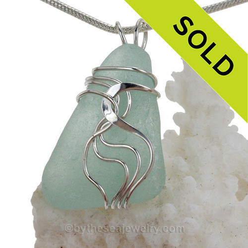A nicely frosted large piece of Aqua Green sea glass set in our signature Waves©  pendant setting in sterling silver.