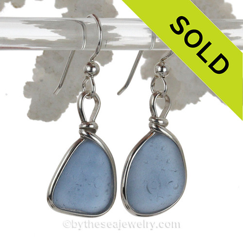 Perfect Carolina Blue sea glass pieces set in a sterling silver earring in our Original Wire Bezel© earring setting.