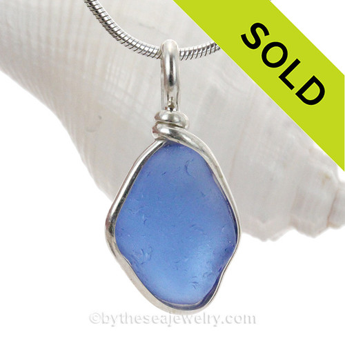 Perfect Carolina Blue Sea Glass set in our Original Wire Bezel© pendant setting  in Solid Sterling Silver.