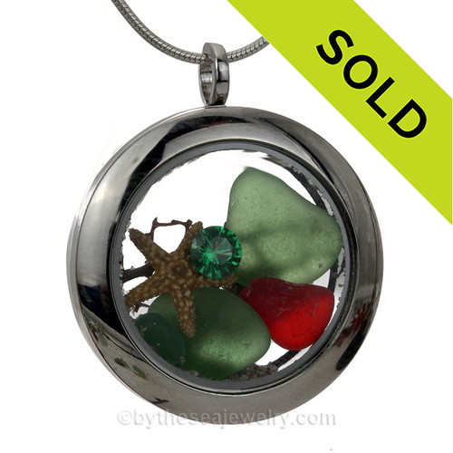 Green & Real and Rare Ruby Red sea glass and a real sand dollar make this a great locket necklace for the holidays.