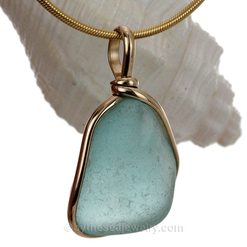Aqua Blue sea glass in gold bezel pendant