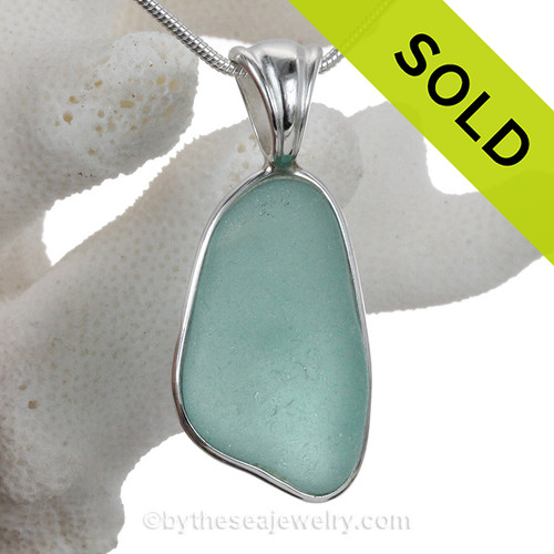 Aqua Genuine Sea Glass set in our Deluxe  Wire Bezel© pendant setting .