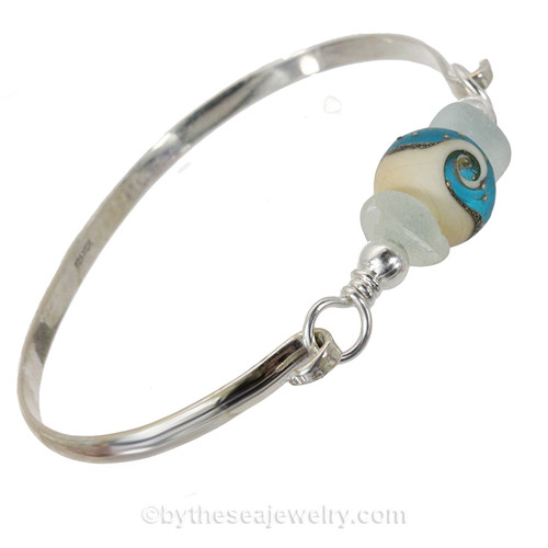 Two pieces of beach found sea glass on this solid sterling silver half round sea glass bangle bracelet. 
