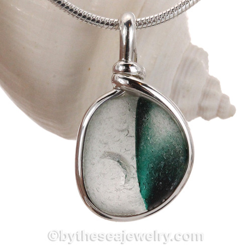 Very 3 dimensional colors that are fused inside this 150 year old sea glass piece found in Seaham England.
