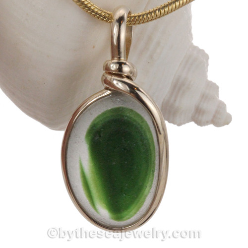 A stunning combination of vivid Green with Bright Gold in this very old English Sea Glass piece and set in our Original Wire Bezel© pendant in Solid Sterling Silver.