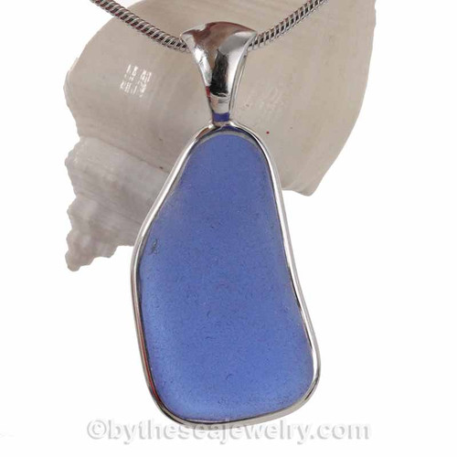 A LARGE and long mid Blue Sea Glass In Solid Sterling Silver Deluxe Wire Bezel© Pendant
This Setting that leaves the sea glass piece just the way it was found on the beach and combines our original deluxe wire setting