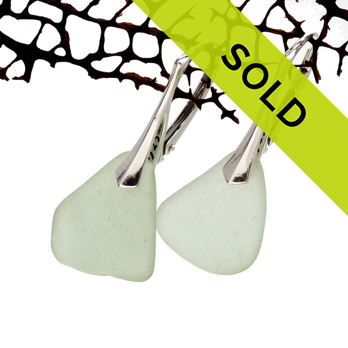 Pale seafoam green sea glass pieces shaped only by the sea, sand and time are suspended on solid sterling leverback earrings.
Sorry these sea glass earrings have been sold!