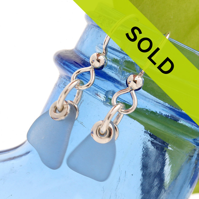 Petite Carolina Blue or perwinkle blue sea glass pieces on sterling silver.
Other than the hole used to incorporate the glass into jewelry, these sea glass pieces were left just the way they were found on the beach.!